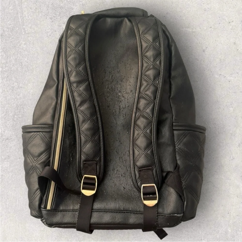 Itzy Ritzy Boss Plus black diaper bag backpack with gold hardware.